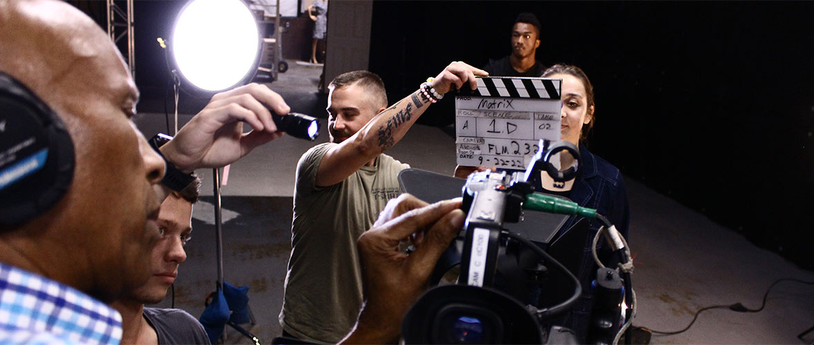 Photo of a film camera operator